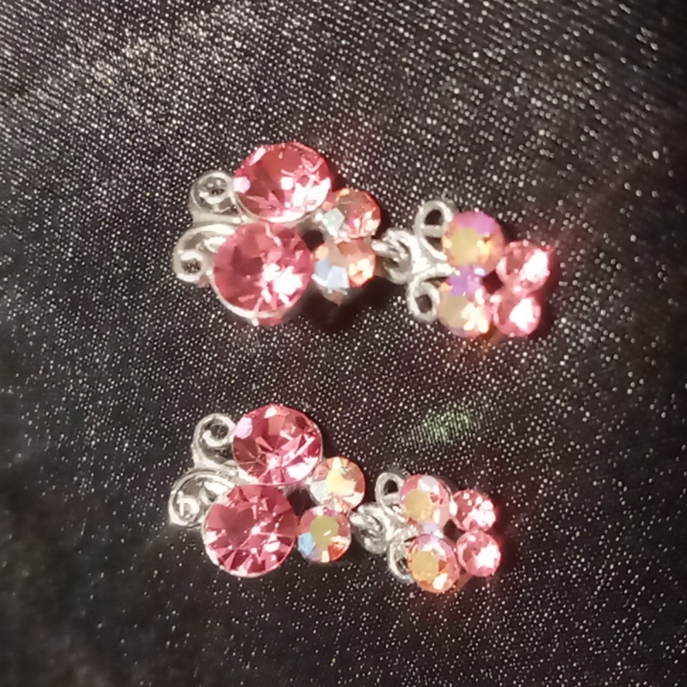 Butterfly's drop earrings. Lightweight opalescence pink stones in silver tone .